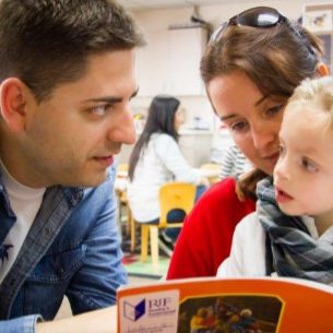 dad-mom-son-reading-book