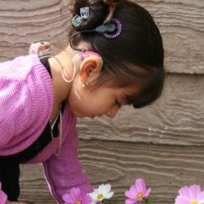 girl-looking-flowers